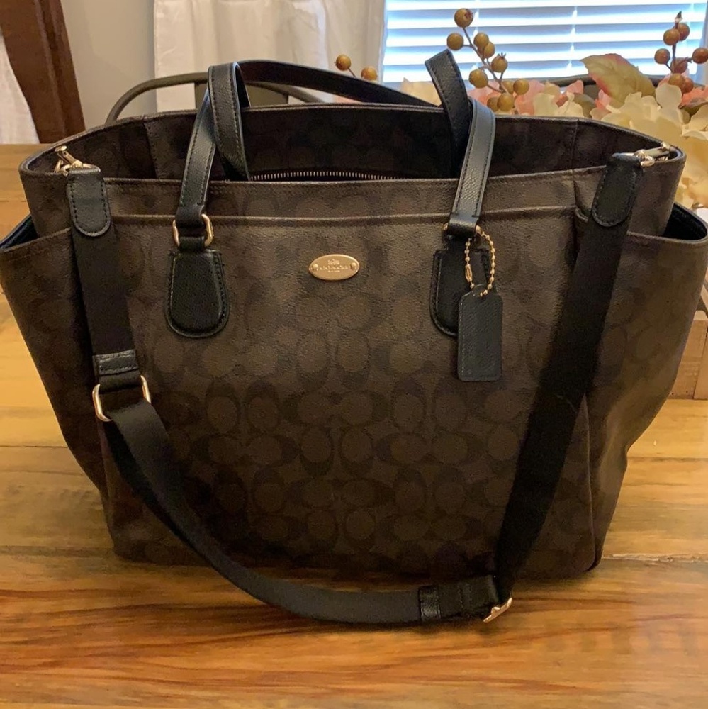 BABY DIAPER BAG IN SIGNATURE COATED CANVAS